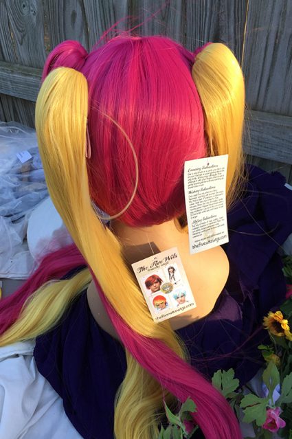 Plumeria wig back view with ponytails